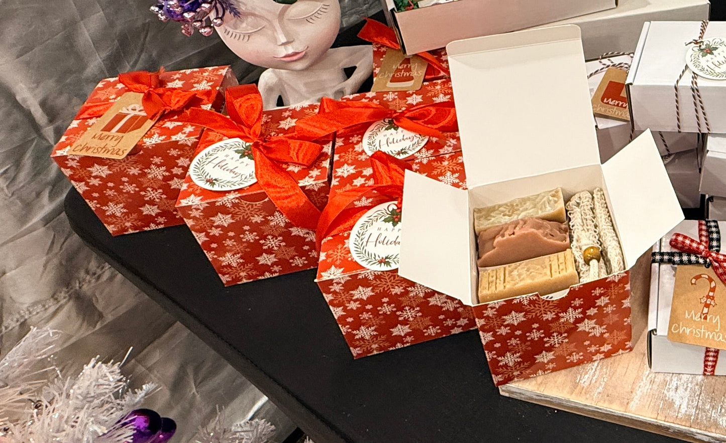 Red gift boxes with snowflake patterns on a table