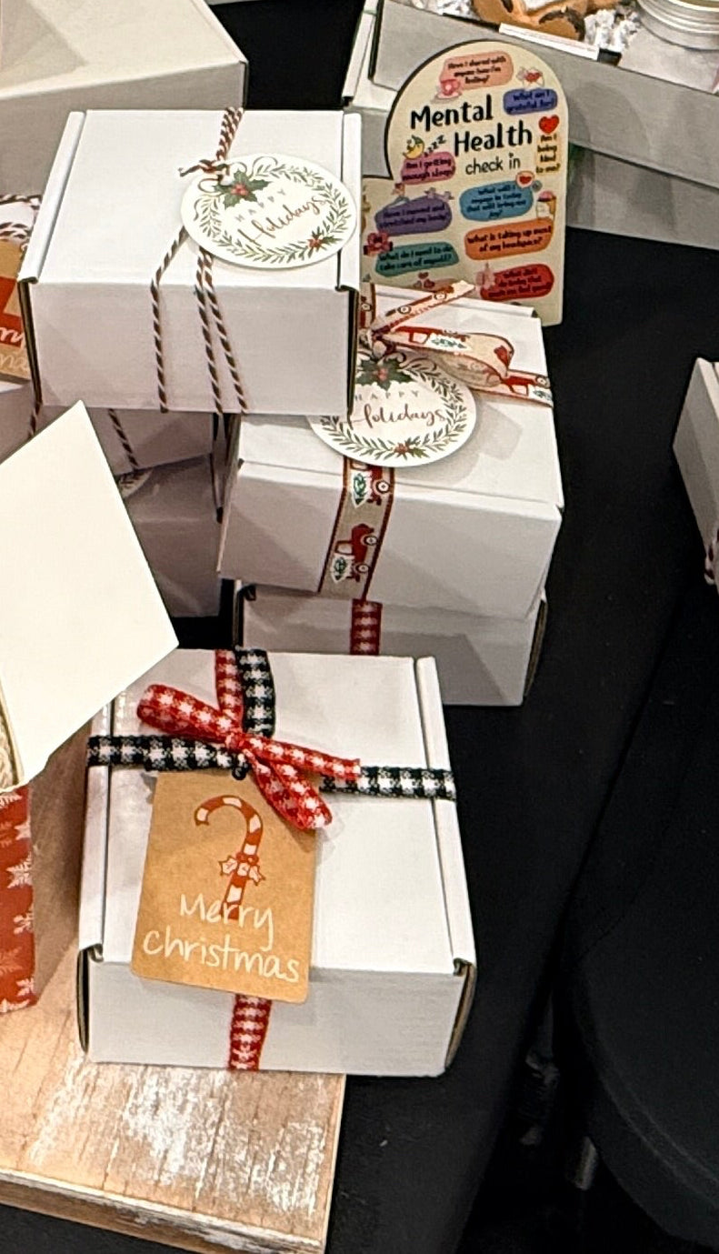 Collection of gift boxes and decorative items on a textured surface